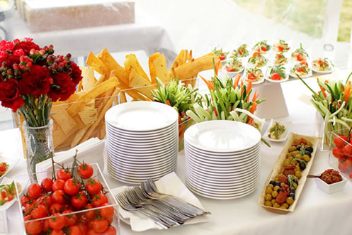 Table filled with plant-based appetizers and party fare