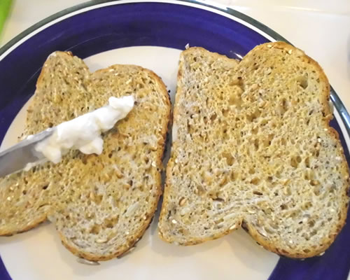 Toast the bread and add the mayo substitute onto each slice of bread.