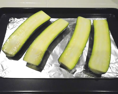 Arrange the zucchini on a baking sheet.