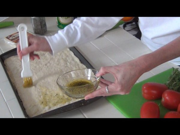 Mix the olive oil, salt and pepper in a small bowl; spread the oil mixture onto a prepared pizza crust.