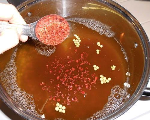 Bring the first three ingredients to a boil in a large pan; simmer covered for one hour.