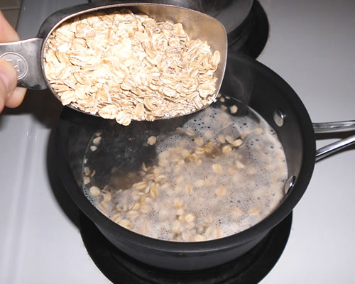 Bring the water to a boil over high heat; add the oats, stir, and lower the heat to medium low.