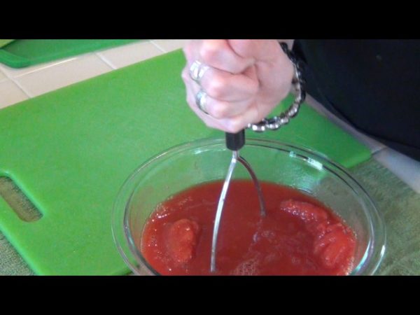 In a medium bowl, use a potato masher to break up the tomatoes.