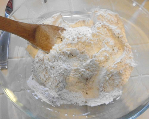 In a large bowl, mix together the dry ingredients; add the milk and oil to the dry mixture, and stir until combined.