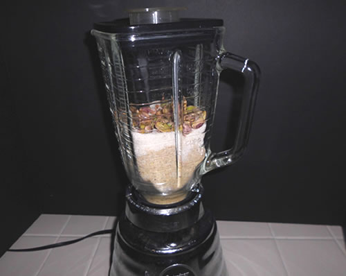 In a blender, pulse together the pistachios and sugar until the nuts are finely chopped.