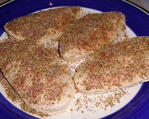 Sprinkle the cutlets with the oregano, salt, pepper and paprika.