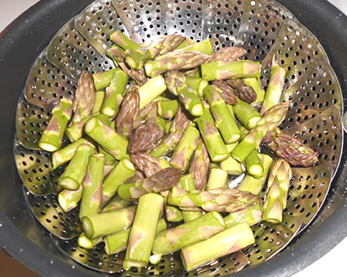 Steam the asparagus for 5 minutes until slightly tender; drain and set aside.