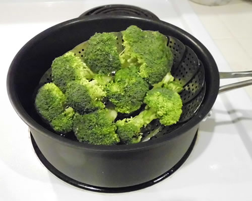 Steam the broccoli (covered) for 5 to 10 minutes or until slightly tender; drain and move to a serving bowl.