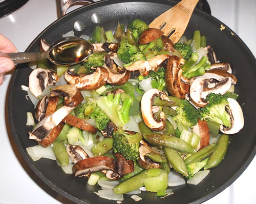 Add the mushrooms, snap peas, green onions, sauces and spices to the pan; simmer covered for approximately 20 to 30 minutes.