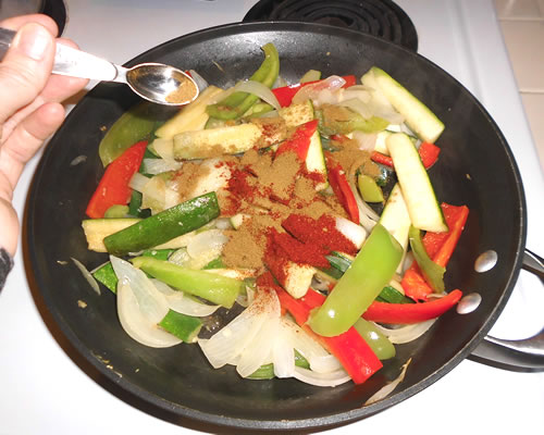 Add the spices and continue to cook (covered) at low heat until the vegetables are tender.