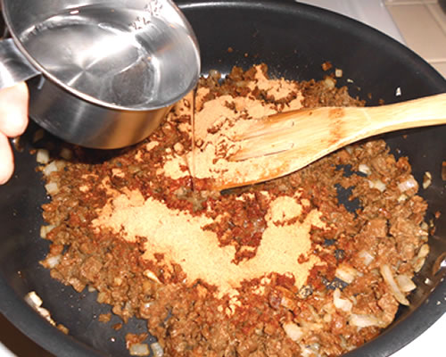 Add the chili powder, cumin, black pepper and water; cook for an additional 10 to 15 minutes.