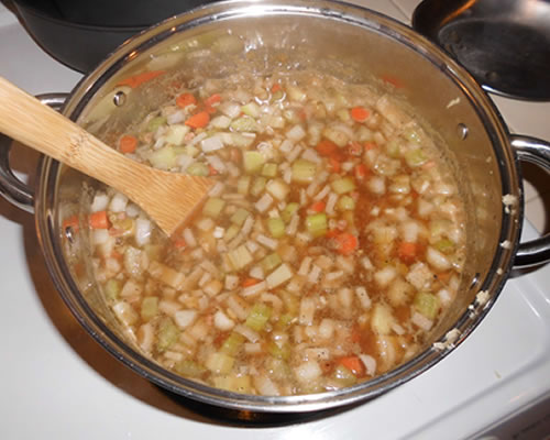 Add the remaining ingredients to the broth mixture; simmer for one to two hours, stirring occasionally.