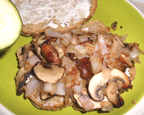 Toast the bread; top the toasted bread with the mayo, mushroom mixture, cucumber, tomato, lettuce, cheese, and avocado.