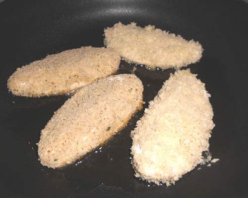 In a large pan, heat the oil and cook the cutlets until slightly golden brown on each side; drain on paper towels.