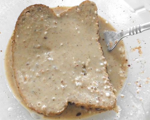 Dip the bread slices into the soy milk mixture; cook in a large lightly oiled pan until browned, flip and cook the other side until browned.
