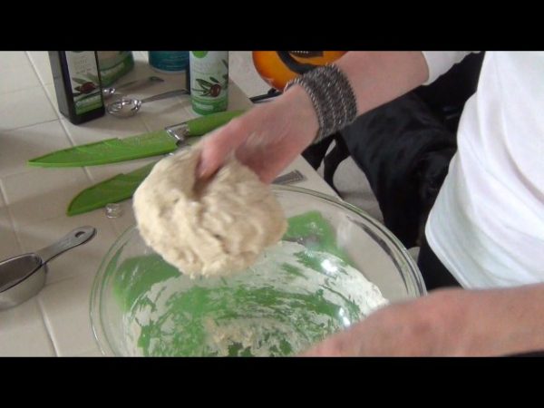 Knead the dough for 5 minutes; form into a large ball and return to the large (greased) bowl; flip over the ball, cover the bowl with a towel, and allow the dough to rise for one hour in a warm area.