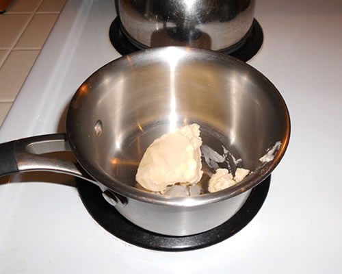 Transfer the popcorn to a large bowl; heat the buttery spread in a small pan until melted, and pour the buttery spread over the popcorn, tossing until well coated.