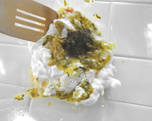 In a large bowl, combine the sour cream, mayonnaise, relish, mustard, salt and pepper.