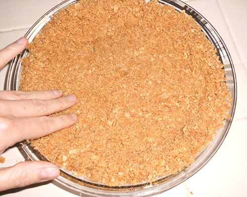 Press the graham cracker mixture into a 9-inch pie plate; fill, and bake at 350 degrees for 10 minutes (or pre-bake, cook, and fill later, depending on the pie filling recipe instructions).
