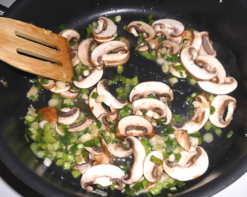 In a large pan, heat the buttery spread and saute the garlic, green onions and mushrooms for approximately 5 minutes; remove from the pan.