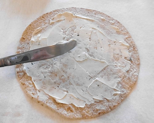 Spread the tortillas with the cream cheese (out to about 1/2 inch from the edges of the tortilla).