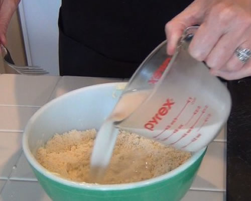Stir in the milk until just blended; turn the dough onto a floured surface and knead the dough for about 5 minutes.