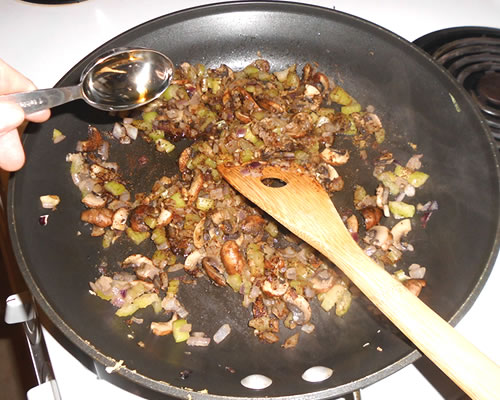 Add the teriyaki sauce and spices to the vegetable mixture; stir and heat thoroughly, and then mix in the cooked rice, black beans, and green chilies.