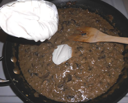 Reduce the heat and simmer uncovered for 10 minutes; stir in the sour cream and heat through.