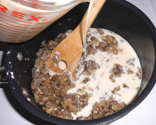 While stirring, gradually add the soy milk to the mixture, cooking and stirring until thick and smooth.