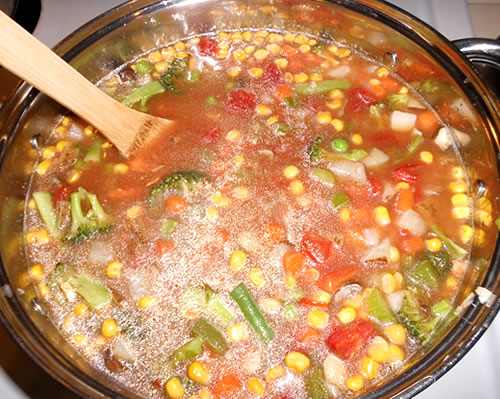 Add the remaining ingredients to the large pan and bring to a boil; lower the heat and continue to cook for approximately an hour or until the vegetables are tender.
