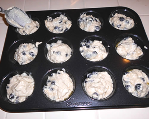 Fill 12 medium muffin tins (bottoms greased) about 3/4 full with the batter; bake at 400 degrees for 20 minutes or until golden brown.