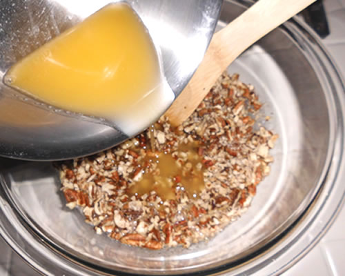 In a separate mixing bowl, beat the egg replacer slightly; stir in the brown sugar, pecans, honey (or agave), and the remaining buttery spread.