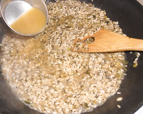 Add 1/2 cup of the vegetable broth to the rice mixture, stirring constantly until the broth is absorbed. Repeat adding 1/2 cup of the broth at a time.