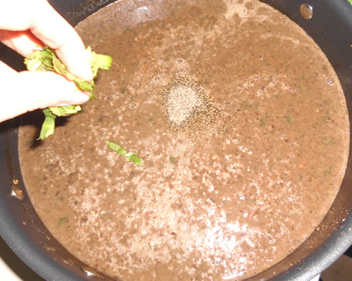 Add the salt and pepper, and mix in the other half of the cilantro.
