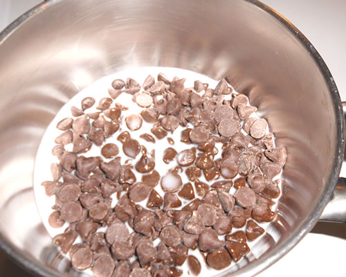 In a double boiler, melt the chocolate and milk, stirring as infrequently as possible.