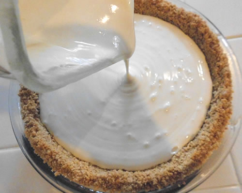 Pour the cream cheese filling mixture into a prepared graham cracker crust; bake at 350 degrees for 25 to 35 minutes or until set.
