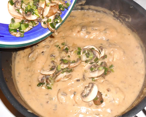 Return the mushroom mixture to the pan, reduce the heat to low, and simmer for another 5 to 10 minutes stirring occasionally. 
