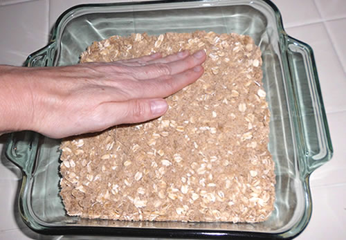 Press the remaining dough into an 8 x 8-inch baking pan (ungreased).