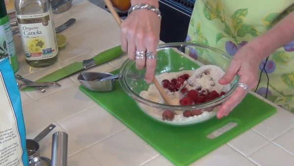 Add the raspberries to the dry ingredients; add the wet mixture to the dry / berry mixture; combine just until mixed.