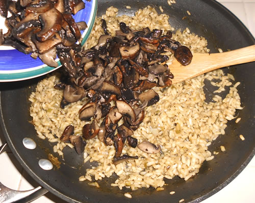 Remove from the heat; stir in the mushrooms (including the liquid), buttery spread, additional green onions, and cheese.