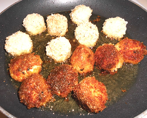 In a large pan, heat the vegetable oil; cook the crab balls until browned on all sides, remove and drain on paper towels.