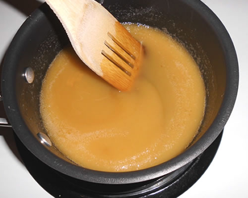 In a small saucepan, combine the buttery spread and sugar over low heat; increase the heat to medium and stir the mixture constantly until it comes to boil. Boil and stir constantly for approximately three minutes.